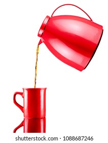 Floating Red Pot Pouring Coffee On A Red Porcelain Mug Cup, White Background Isolated