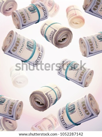 Floating rolls of one hundred US dollar bills isolated on white background. Financial concept representing wealth, investment, cash flow, business success, banking and economic growth. Ideal for finance and business-related designs.