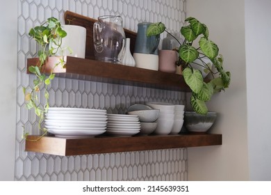 Floating Shelves With Ceramic Dishes Featuring Boho Kitchen Aesthetic