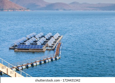 Floating solar panel on water in a dam. Produce electricity in a clean technology concept.