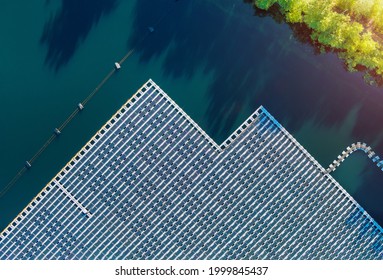 Floating solar panels platform on the beautiful lake renewable alternative electricity energy of panorama aerial view