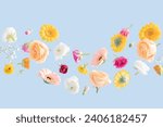 Floating Spring Flowers on a blue background. Background suitable for Spring, Summer, Mother