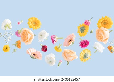 Floating Spring Flowers on a blue background. Background suitable for Spring, Summer, Mother's Day, International Women's Day, Weddings, and more uses.