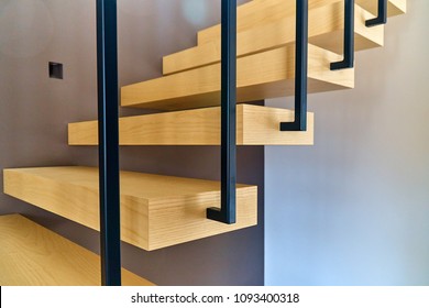 Floating Stairs. Ash Lumber Stairs With Railing Attached To Brown Wall And Leading To Second Floor Inside Stylish Modern House