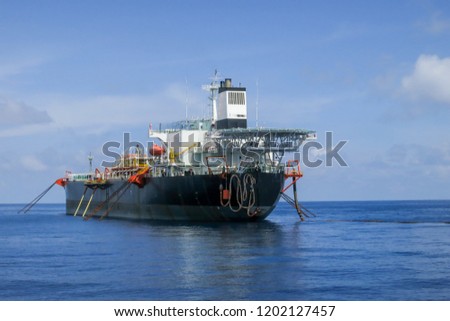 Floating Storage Offloading tanker ship or also known as FSO floating in the open sea.