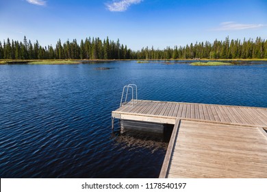Floating swimming raft dock on a forest lake in Central Norway - Powered by Shutterstock