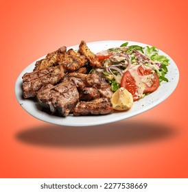 Floating White plate with Mixed meat grilled and salad  on orange gradient background - Shutterstock ID 2277538669