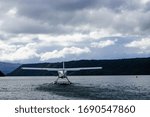 Floatplane taking off on lake in Rotorua, New Zealand