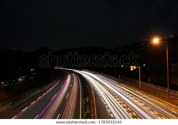 Flock of cars running in the\
dark