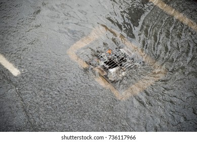 Flood After The Rain Is Flowing Down The Drain On The Road