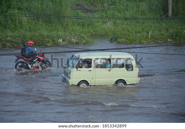 flood atmosphere in the middle of an\
urban area in Sidoarjo: Indonesia - January 12,\
2019