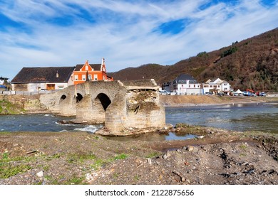 Flood damage in Ahrtal and Eifel. Reconstruction after cleanup. Nepomukbrücke in Rech, Germany - Shutterstock ID 2122875656