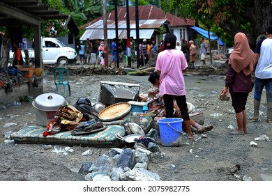 Flood Disasters Often Hit Remote Villages, People Clean Up The Remaining Mud.