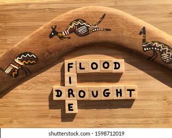 Flood, Fire, Drought In 3d Wooden Alphabet Letters And A Boomerang. Creative Concept. Climate Crisis In Australia