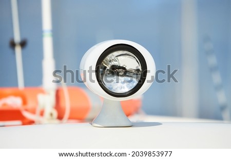Flood light on the roof of a boat. Navigation light for travelling at night and the correct mooring. Ship's searchlight.