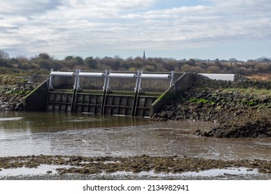 Flood protection Sluice gates under a small bridge on the coastal road between Coney Island village and Killough in County Down Northern Ireland