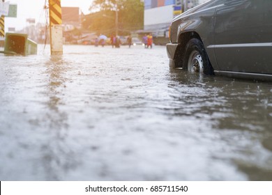 flood water - people walking in the rain on flooded road - Shutterstock ID 685711540
