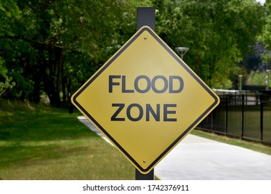 A Flood Zone Warning Sign In The Park