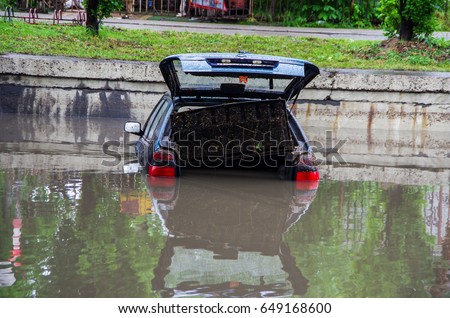 Flooded car. Natural disasters, floods.