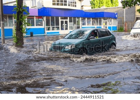 Flooded Car: Vehicle Engulfed by Rising Waters