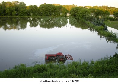 Flooded Farm Field And Tractor