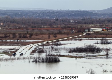 Flooded fields and roads in winter - Shutterstock ID 2258069097