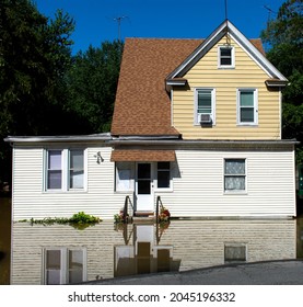 Flooded House In A Neighborhood