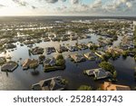 Flooded houses from hurricane rainfall water in Florida residential community. Aftermath of natural disaster in USA south