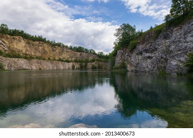 Flooded quarry in the Czech Republic near the town of Mikulov in Europe. Beautiful landscape with a water surface.