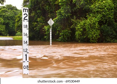 A Flooded Road With Depth Indicators In Queensland, Australia