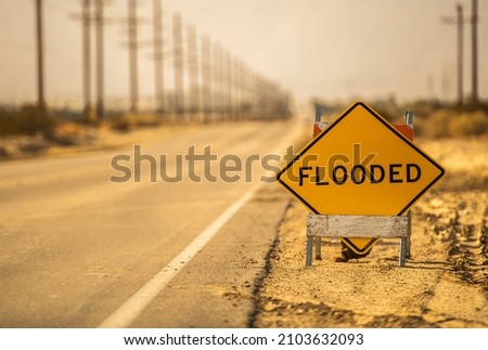 Flooded Road Warning Sign on a Desert Road Somewhere in Southern California, United States of America.