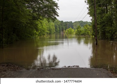 Flooded Roadway Near River, Danger Disaster Area Turn Around Don't Drown