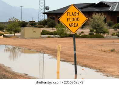 flooded street area in Maricopa Arizona after summer monsoon storm - Shutterstock ID 2355862573