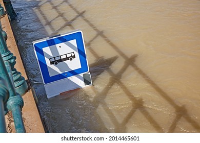 Flooded Street With Bus Station Sign On A Street Under Water