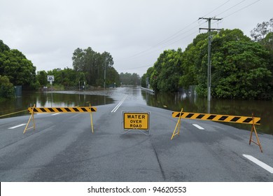 Flooded Suburban Road With Road Block In Australia