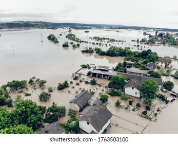 Flooded Village On Ukraine. Natural Disaster In Halych, Courtyards And Streets In Dirty Yellow Water. Global Catastrophe, Climate Change, Flood Concept