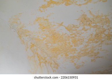 Flooding rainwater, causing damage, peeling paint and mildew. - Shutterstock ID 2206150931