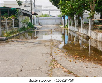 Flooding roadway as the clogged or ineffective street drainage system failed to release the water from the road