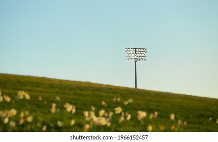 The floodlight in the evening with a soft yellow, blue sky.