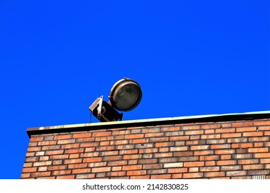 A Floodlight On A Brick Wall