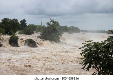 Floods in Laos.The danger of heavy rain from hurricane caused the floods flooded houses, road and trees broken.