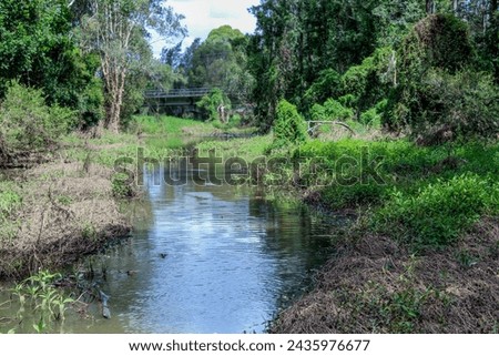 Floodway creek running through farmland