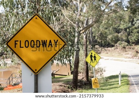 Floodway road subject to flooding.  Sections of roads which have been designed to be overtopped by floodwater. Infrastructure to service locations prone to floods. 