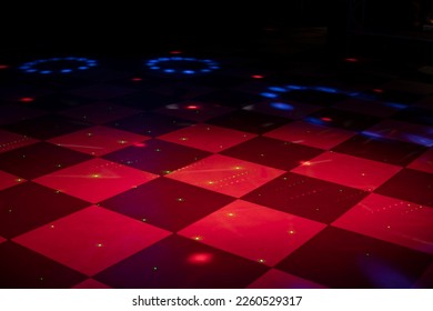 Floor in cage. Floor for dancing. Color music in hall. Bar interior. Black and white check in red. - Powered by Shutterstock