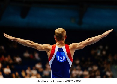 Floor Exercise Male Gymnast To Competition In Gymnastics In Background Is Tribune Fans