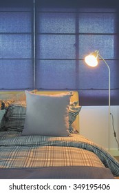 Floor Lamp Next To Comfy Bed In Night Time