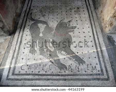Floor mosaic with â??Beware of the dogâ?� warning at the ancient Roman city of Pompeii, which was destroyed and buried by ash during the eruption of Mount Vesuvius in 79 AD