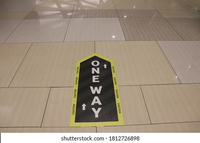 Floor With One-way Warning Sticker. Health Protocol In The Modern Market During The New Normal