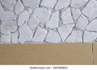 A Floor With Porcelain Stoneware Tiles And White Stone Decorations Inside A House. Many Dog Hairs On The Surface Of The Floor.
