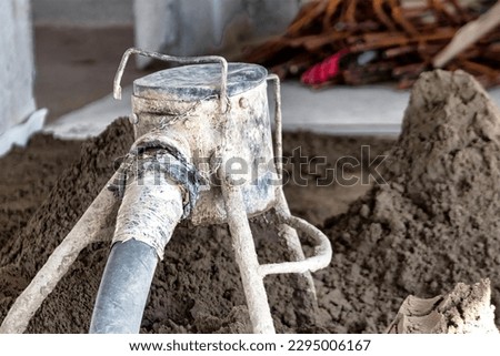Floor screed with cement mortar. Leveling the floor surface. Repair of a residential building. Solution supply. Device for supplying cement mortar Stock photo © 